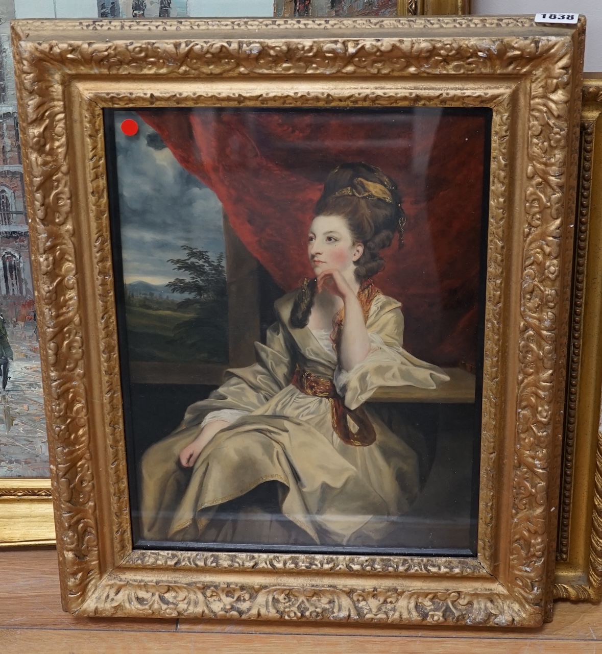 Late 18th / early 19th century, English School, oil, Portrait of a seated woman before a landscape, unsigned, 38 x 28cm. Condition - fair to good